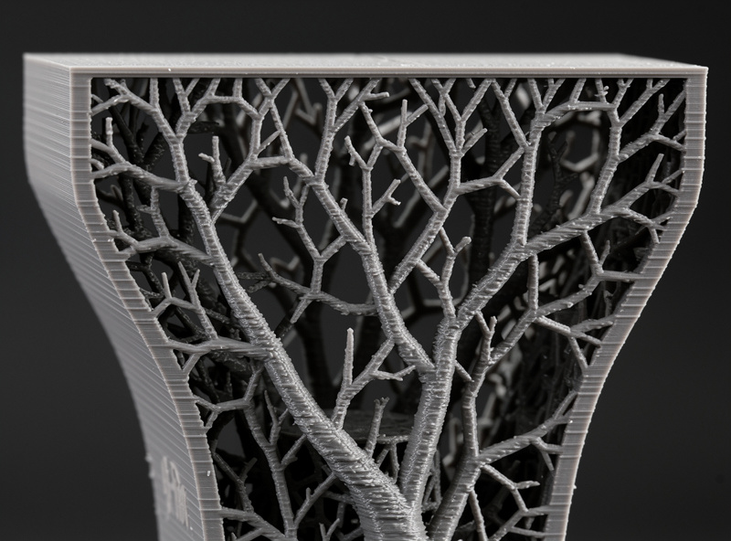 Lightning infill 3D print pattern with tree-like sparse internal structure supporting only the top surface
