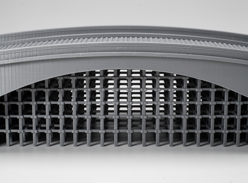 Traditional grid-pattern normal supports under a 3D printed bridge with dense rectangular structure