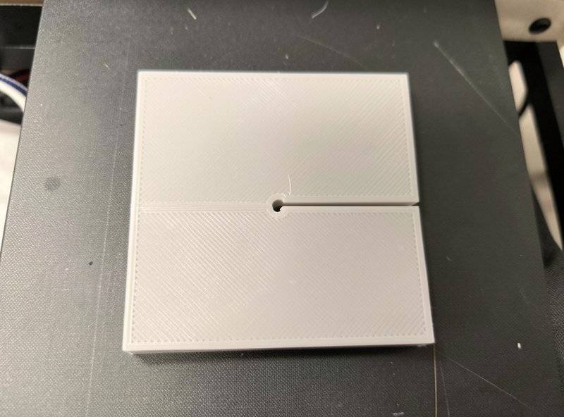 A flat 3D printed part with a thin living hinge section printed in the bed plane