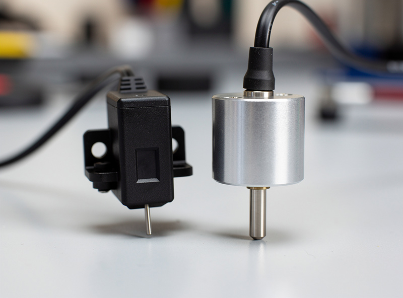 BLTouch and CR Touch bed leveling probes side by side showing the metal pin difference