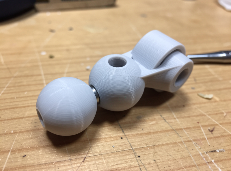 A print-in-place ball joint and articulating mechanism printed as one piece